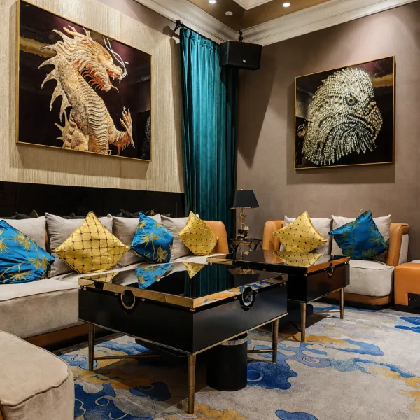 Cream sofa lounge with blue cushions and animal artwork