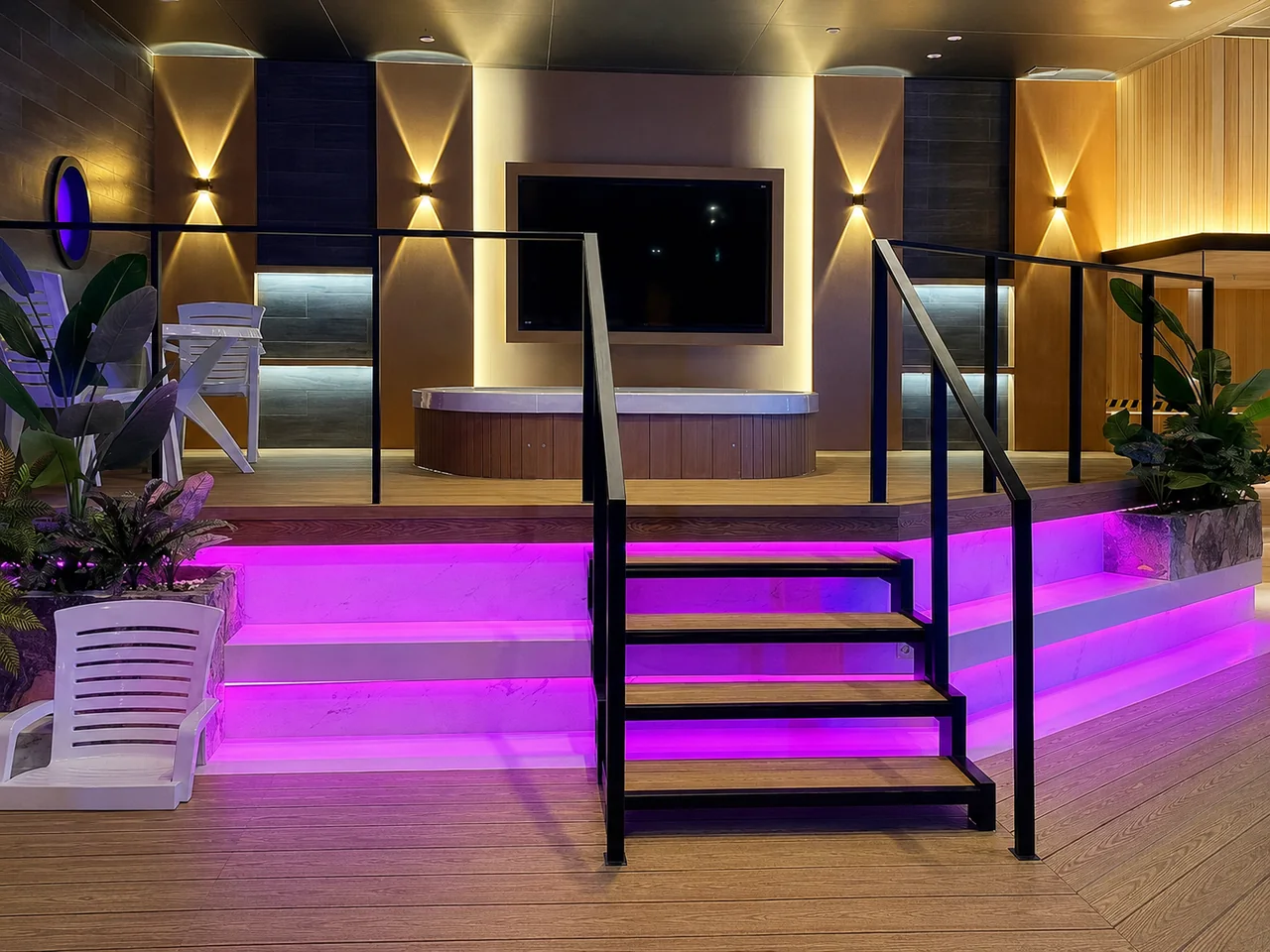 Raised lounge platform with pink illuminated steps