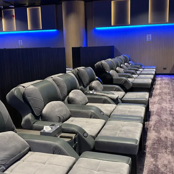 Close view of grey recliners with footrests