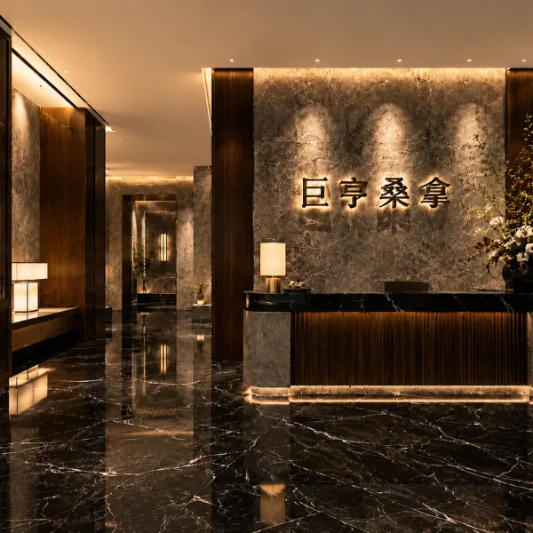 Black marble reception desk with illuminated wall sign