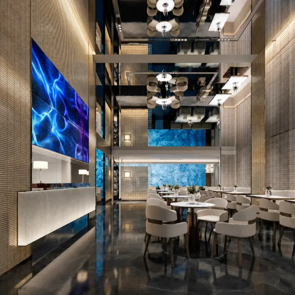 Double-height dining hall with mirrored ceiling and blue screen