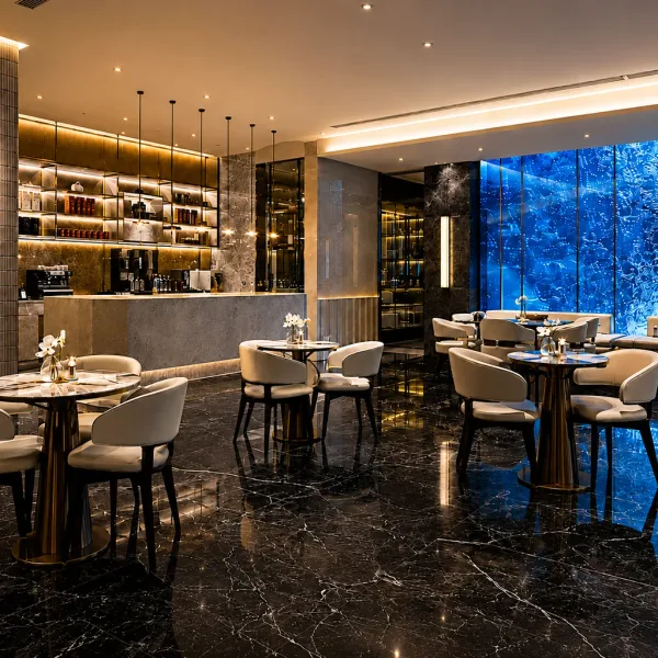 Dining lounge with cream chairs, backlit bar, and blue wall