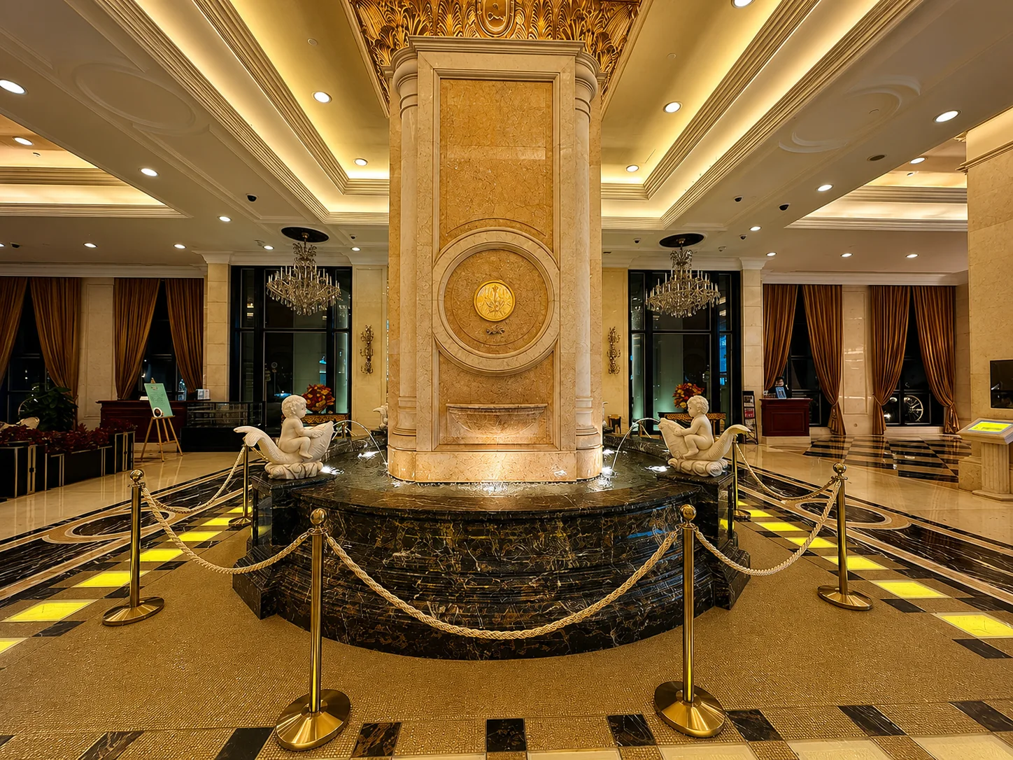 Grand marble lobby with central fountain column