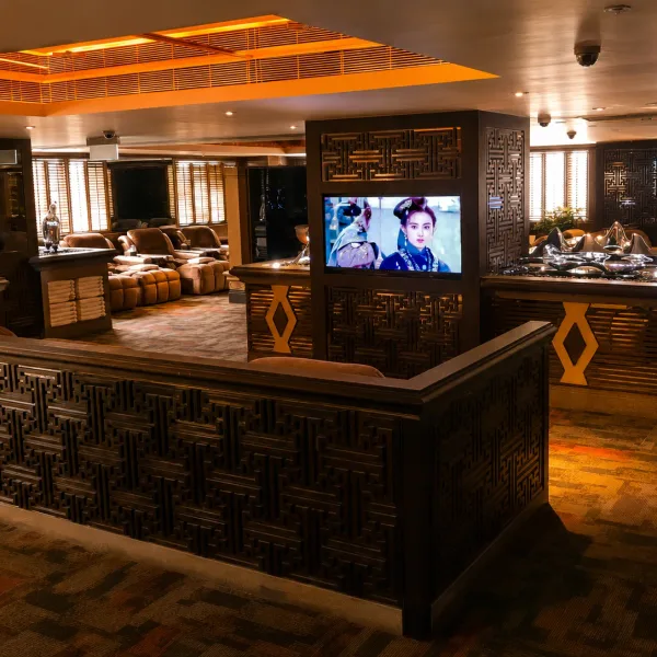 Warm timber lounge with central television counter
