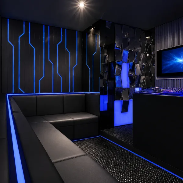 Compact black lounge with blue circuit-like wall lights