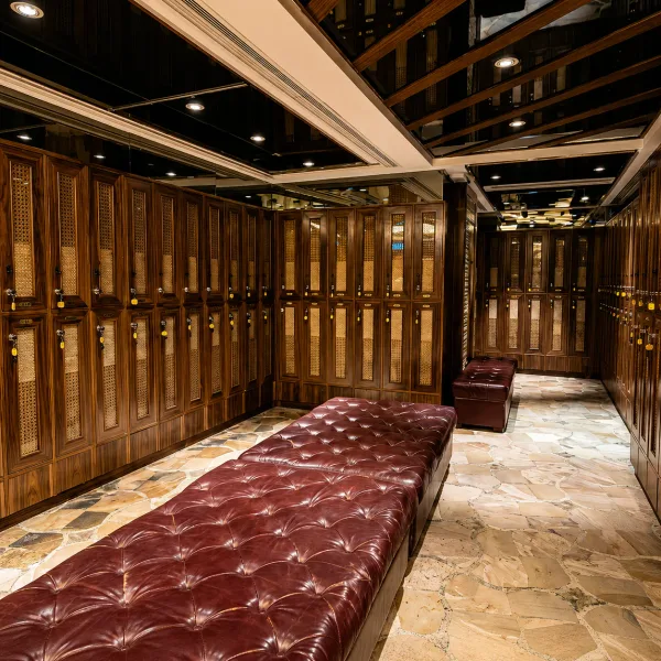 Wood-panelled locker room with long tufted bench