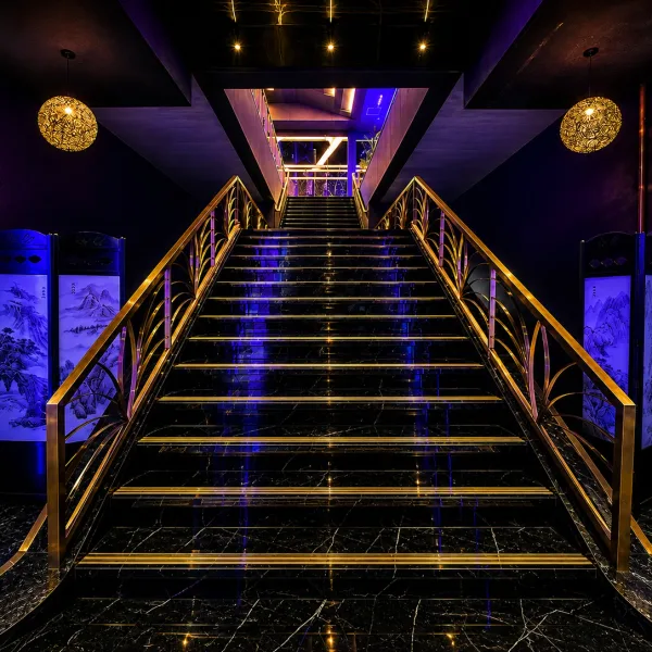 Symmetrical black staircase edged in blue light