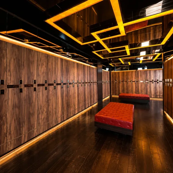 Wood locker room with red benches and gold ceiling lines