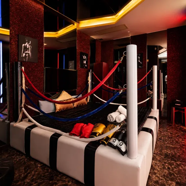 Red and black themed suite with suspended fabric seats