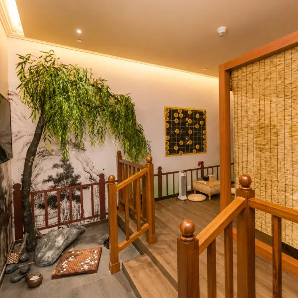 Japanese-style room with bamboo screens and indoor greenery
