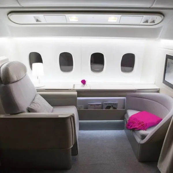 White aircraft cabin set with two grey seats