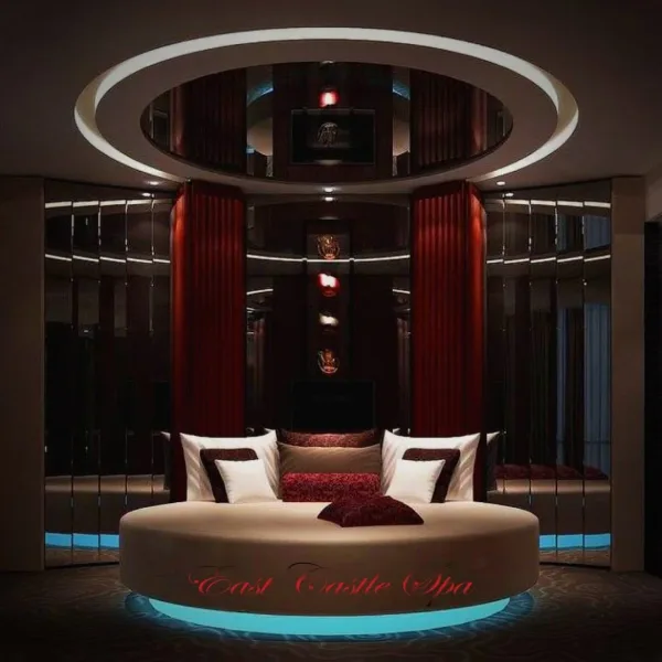 Round bed beneath a circular mirrored ceiling