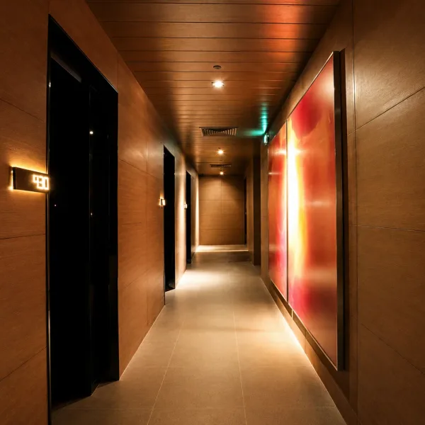 Wood corridor with red illuminated abstract wall panel