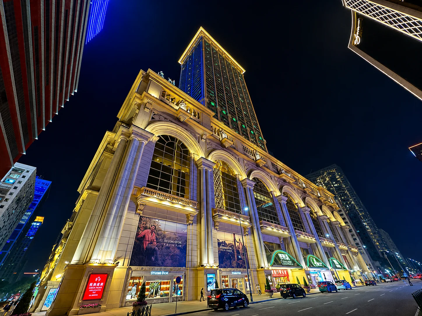 Ornate hotel tower illuminated at night