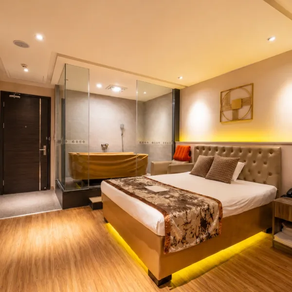 Modern bedroom with glass shower enclosure